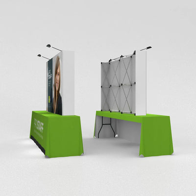 Pop-up fabric display on folding table for trade shows and exhibitions with overhead spotlights