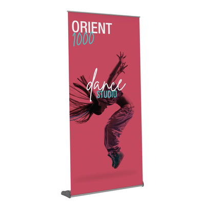 Retractable banner stand displaying dynamic dance studio advertisement for trade shows and exhibitions
