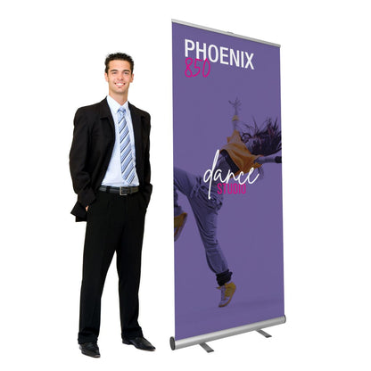 Businessman standing next to a Phoenix 850 banner stand for trade shows and exhibitions