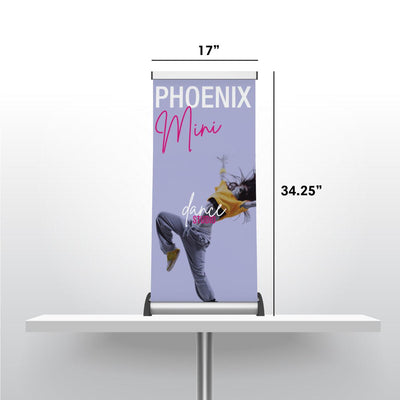 Compact Phoenix Mini banner stand on a table featuring dynamic dance studio graphics for trade shows and exhibitions