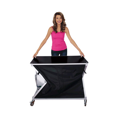 Portable trade show counter with folding design and wheeled base displayed by woman for exhibitions and events