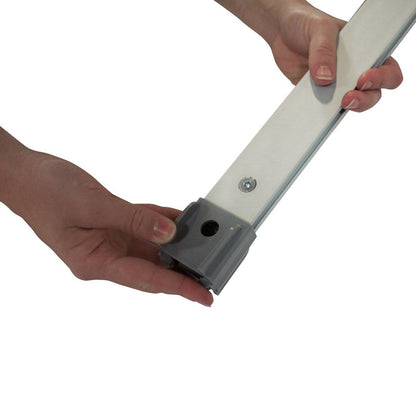 Hands assembling a banner stand accessory kit component for trade show and exhibition displays
