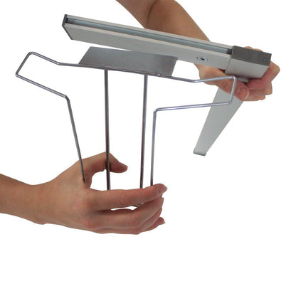 Hands assembling metal frame accessory kit for banner stand used in trade shows and exhibitions