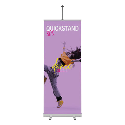Retractable banner stand displaying vibrant dance studio advertisement for trade shows and exhibitions