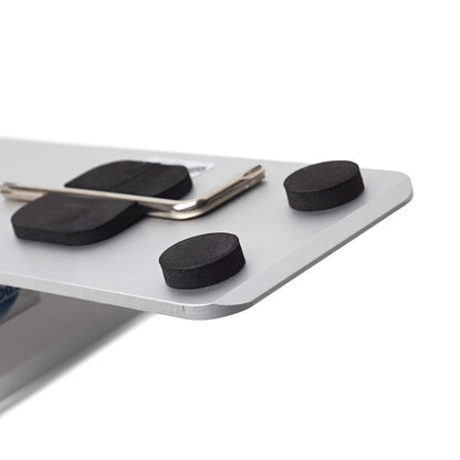 Close-up of a rigid sign panel base with protective black foam pads and an Allen wrench, used for trade shows and exhibitions