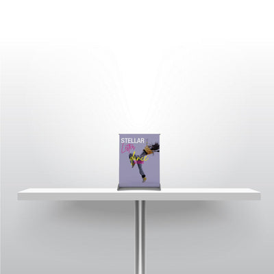 Compact tabletop banner stand displaying dance studio graphics for trade shows and events