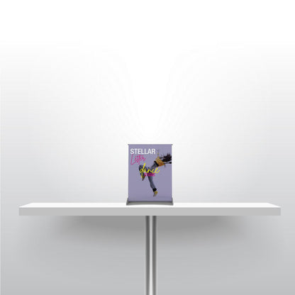 Compact tabletop banner stand displaying dance studio graphics for trade shows and events