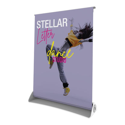 Promotional tabletop banner stand featuring dynamic dance studio advertisement for trade shows and exhibitions