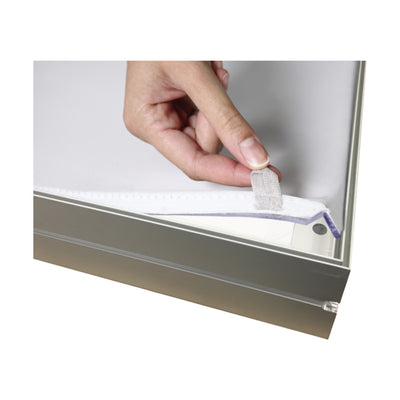 Hand attaching fabric with hook-and-loop fastener to aluminum frame for exhibition display