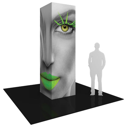 Tall three-sided trade show tower display featuring a large face graphic with highlighted eye, lips, and lashes for exhibitions and events