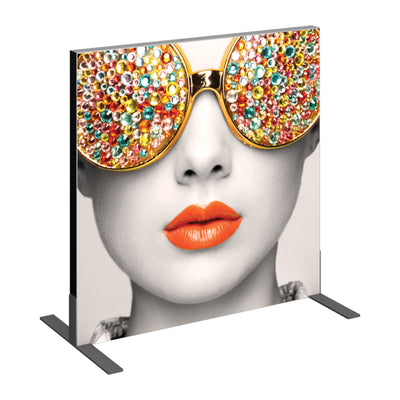 Trade show fabric display featuring close-up of a stylized face with embellished sunglasses and glossy lips