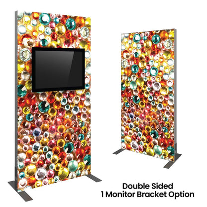 Double-sided trade show display kiosk with colorful gem pattern and single monitor bracket option