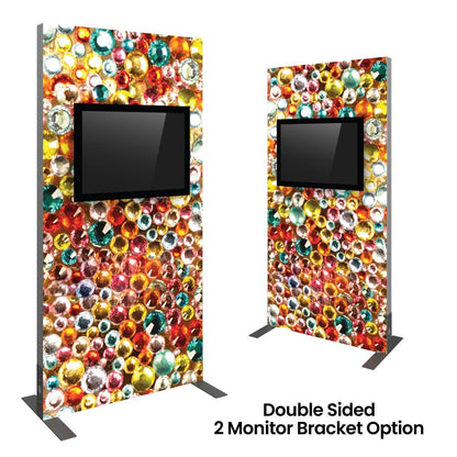 Double-sided trade show kiosk with monitor mount and colorful decorative graphic panel for events