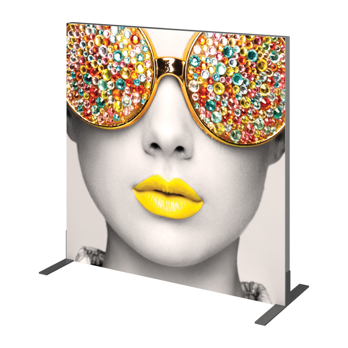 Trade show fabric display featuring close-up of woman's face with embellished sunglasses and prominent lips