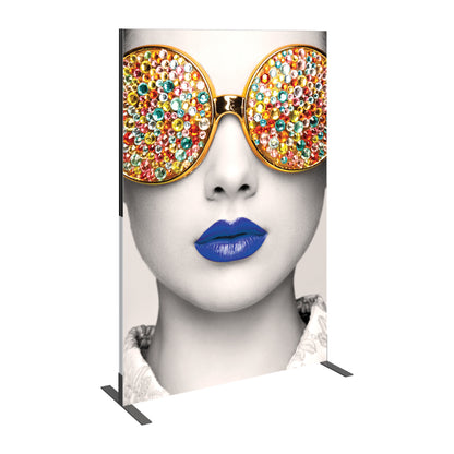 Large freestanding trade show display with artistic face featuring oversized jeweled sunglasses and bold lips