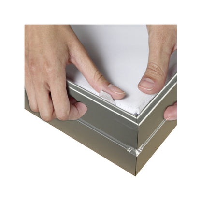 Hands assembling a fabric graphic frame for trade show or exhibition display