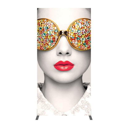 Tall fabric display stand featuring close-up portrait with decorative sunglasses and red lips for trade shows