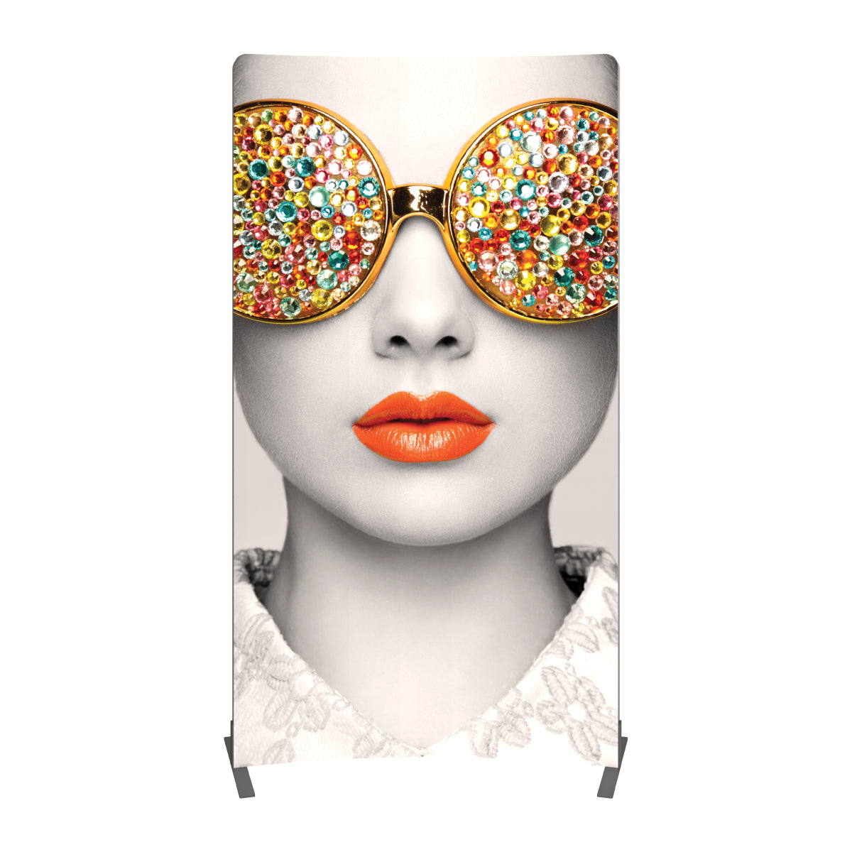 Tall fabric trade show display featuring close-up woman's face with jeweled sunglasses and bright lips