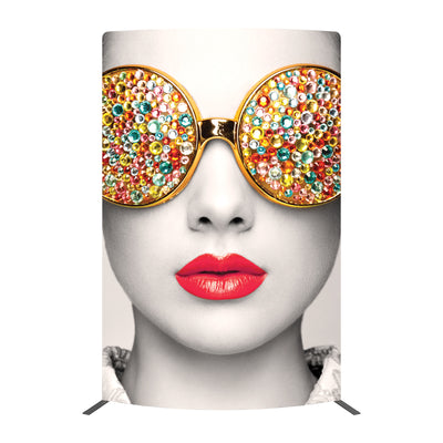 Curved trade show display featuring a close-up face with jeweled round sunglasses and red lips for exhibitions