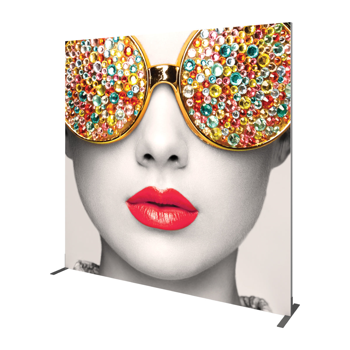 Large graphic display featuring close-up face with jeweled sunglasses and red lips for trade shows and exhibitions