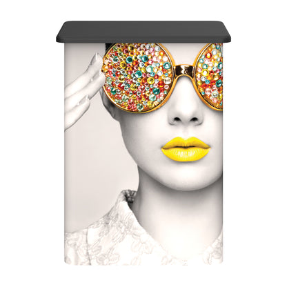 advertising counter featuring close-up of woman with decorative sunglasses and yellow lips for trade shows