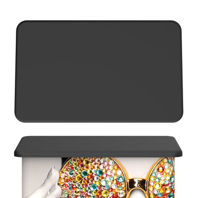 Trade show counter with large graphic panel featuring colorful bejeweled glasses, ideal for exhibitions