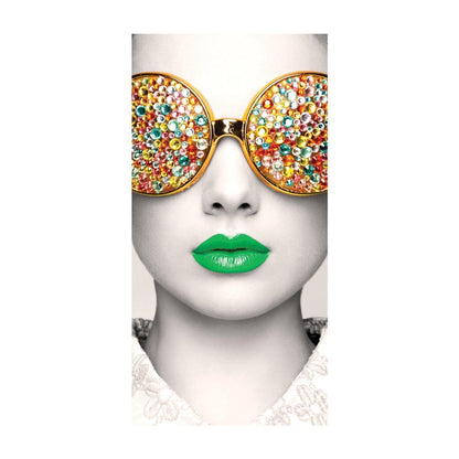 Graphic wall display featuring a stylized face with decorative sunglasses and vibrant green lips for trade shows