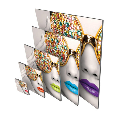 Modular trade show displays featuring close-up artwork of a face with jeweled sunglasses and colorful lips