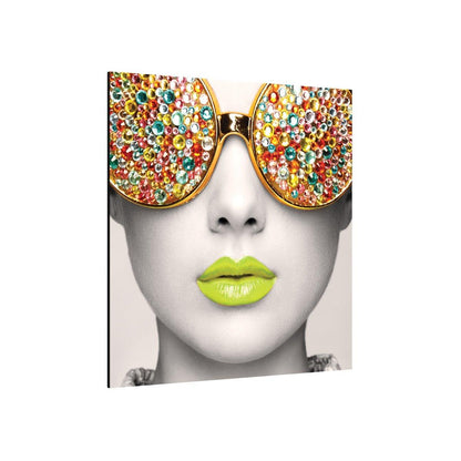 trade show wall display featuring close-up portrait with gemstone sunglasses and vibrant lips