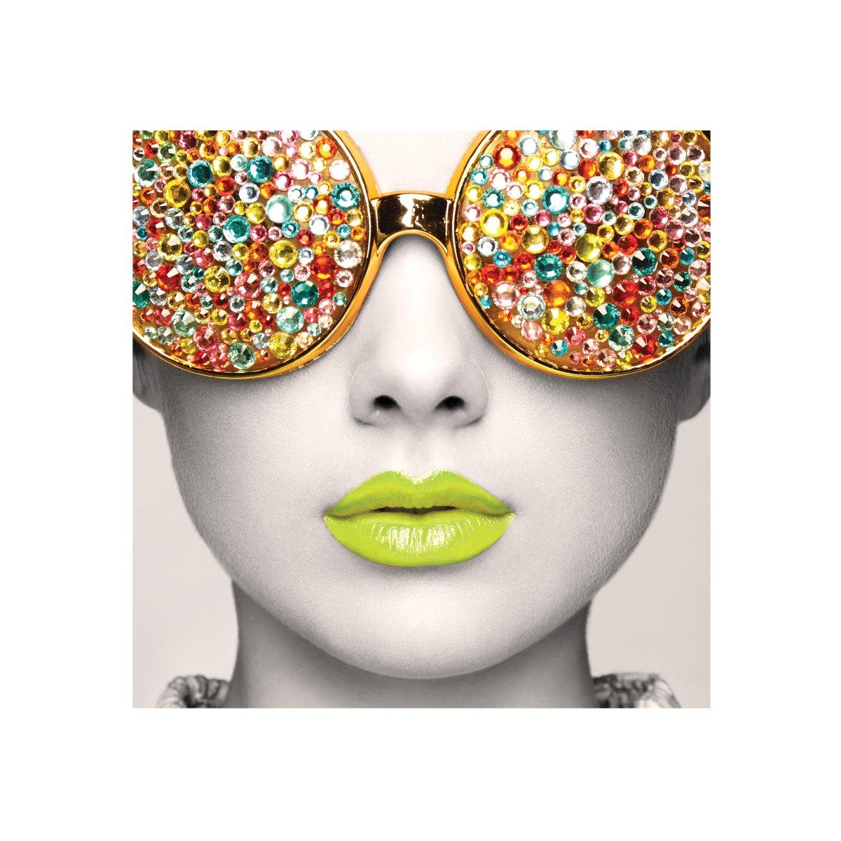 Close-up of a decorative display featuring a face with embellished oversized sunglasses and vibrant lips for trade shows and exhibitions