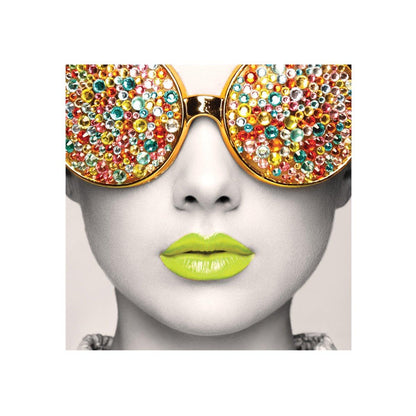 Close-up of a decorative display featuring a face with embellished oversized sunglasses and vibrant lips for trade shows and exhibitions