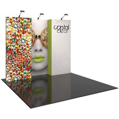 Three-panel trade show display with decorative gems, woman's face with sunglasses, and crystal clear branding