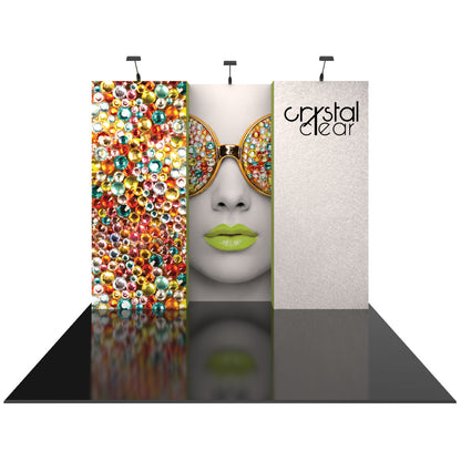 Three-panel trade show display with decorative crystals and stylized face graphic, branded Crystal Clear