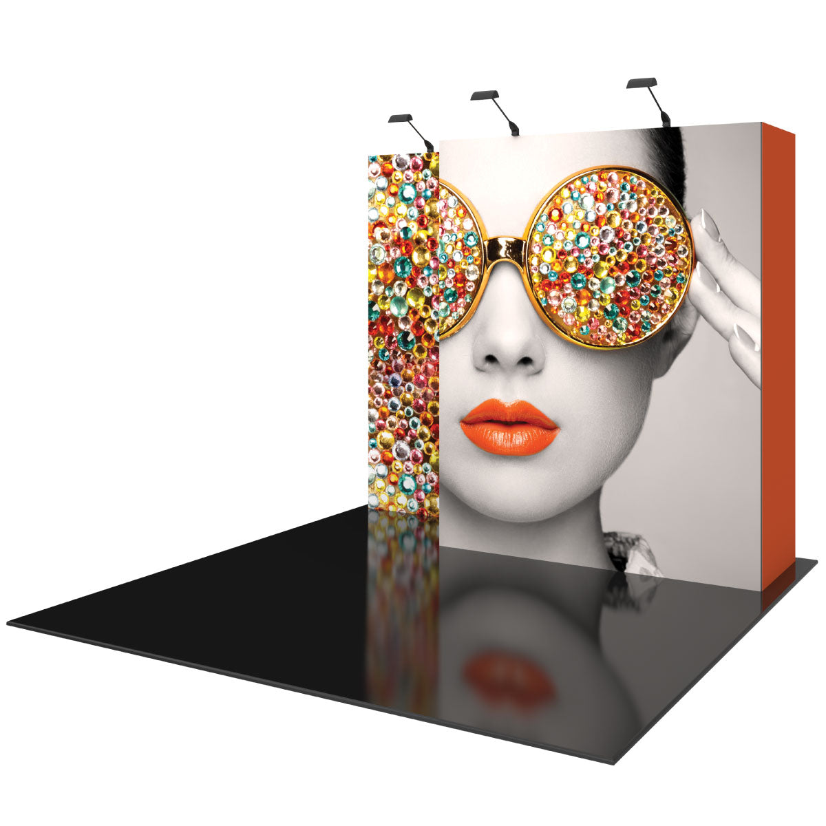 Trade show display featuring large graphic of woman wearing embellished sunglasses and red lips