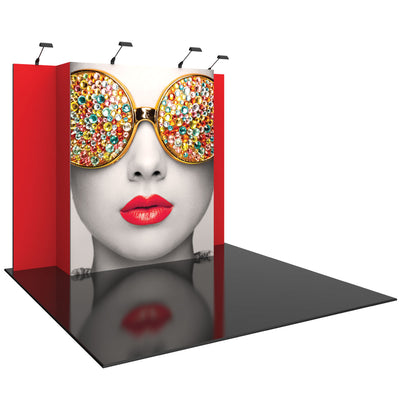 Trade show display with large face graphic featuring jeweled sunglasses and bold lips on foldable panel backdrop