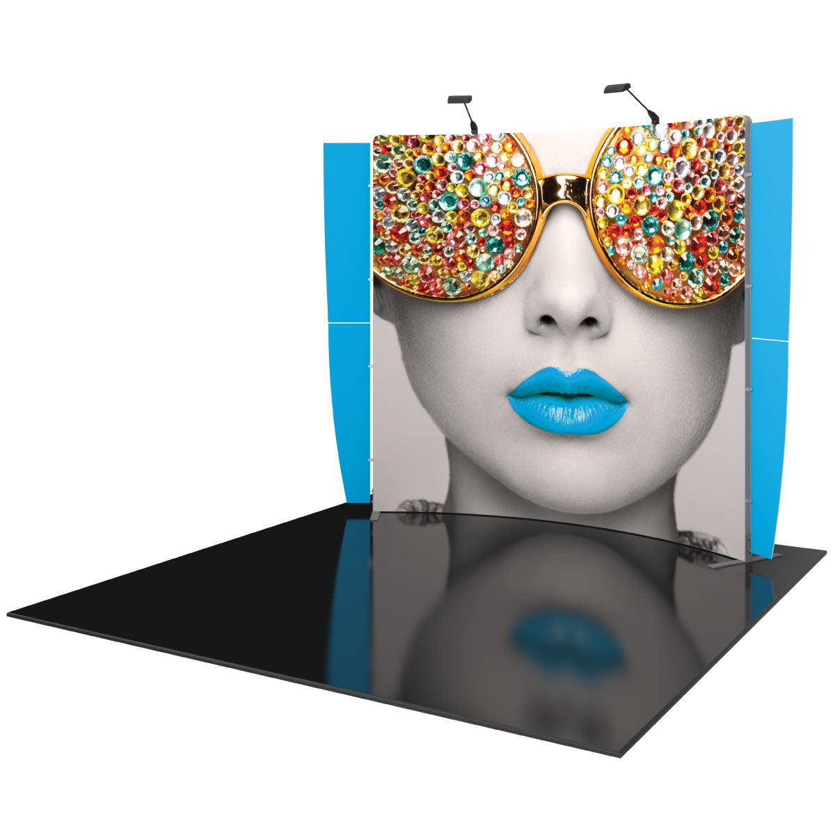 Trade show pop-up display with oversized graphic of a woman's face wearing decorated sunglasses and vibrant lips