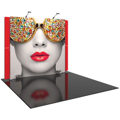 trade show display with large graphic of woman's face wearing jeweled sunglasses and bold lips