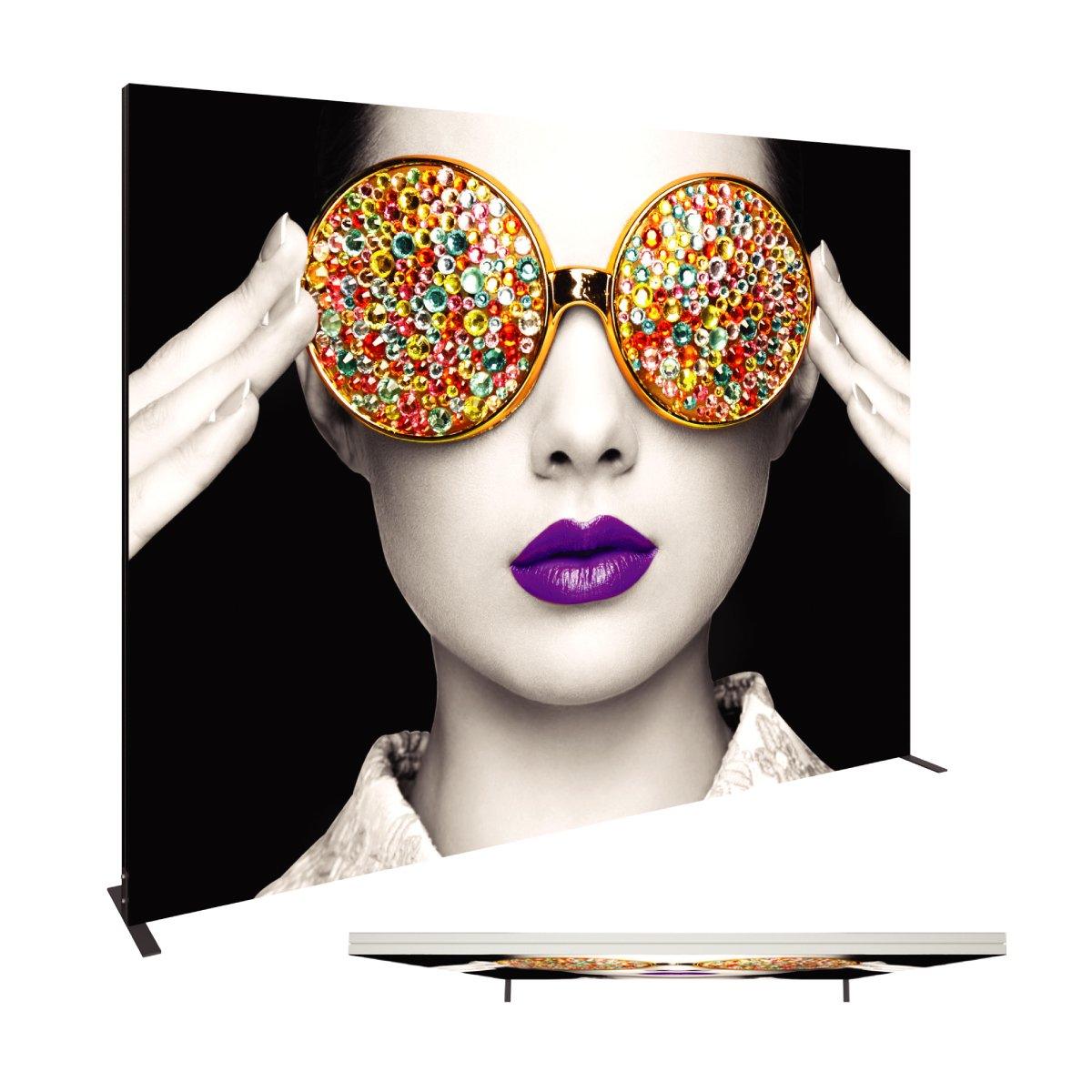 Large trade show fabric display featuring a close-up black and white portrait with colorful gemstone sunglasses and vibrant lips
