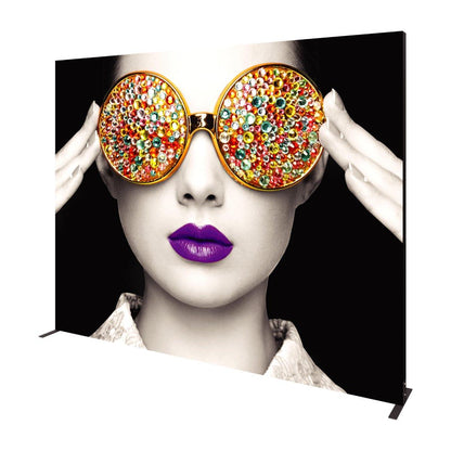 Large trade show backdrop featuring artistic portrait of woman with jeweled sunglasses and bold lips