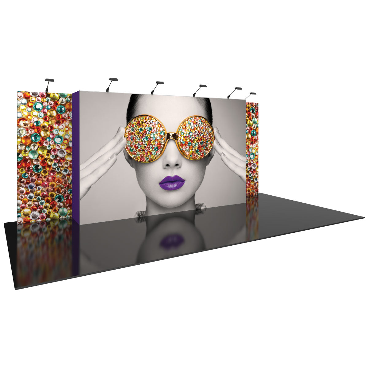 Large trade show booth with striking graphic of a woman wearing decorative sunglasses and lipstick on glossy floor