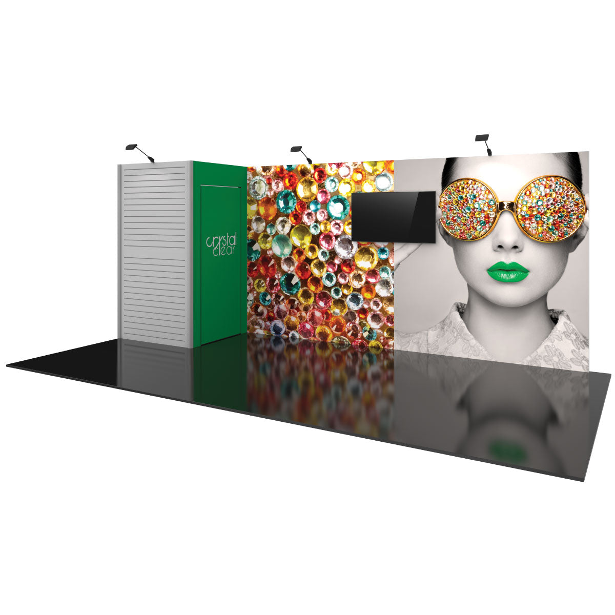Trade show booth with large graphic walls featuring colorful crystal design and a woman's face with jeweled glasses, includes mounted display screen