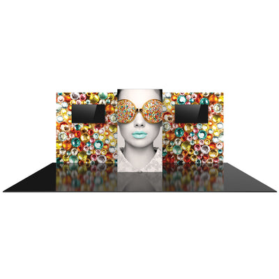 Trade show display with large graphic of model wearing embellished sunglasses and two screens on decorative panel walls