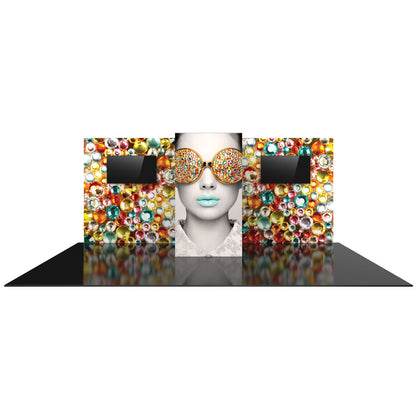 Trade show display with large graphic of model wearing embellished sunglasses and two screens on decorative panel walls