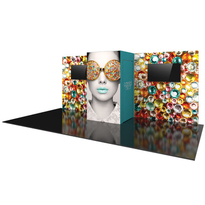 Trade show display booth with vibrant gem-patterned walls, large graphic panel, and mounted screens for exhibitions