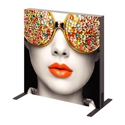 Large fabric display frame featuring close-up portrait with decorative sunglasses and bright lips for trade shows