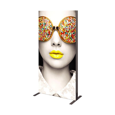 Vertical trade show fabric display featuring artistic face with colorful embellished sunglasses and bold lips