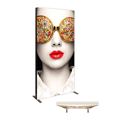 Large vertical lightbox display featuring artistic close-up of face with embellished sunglasses and bold lips for trade shows