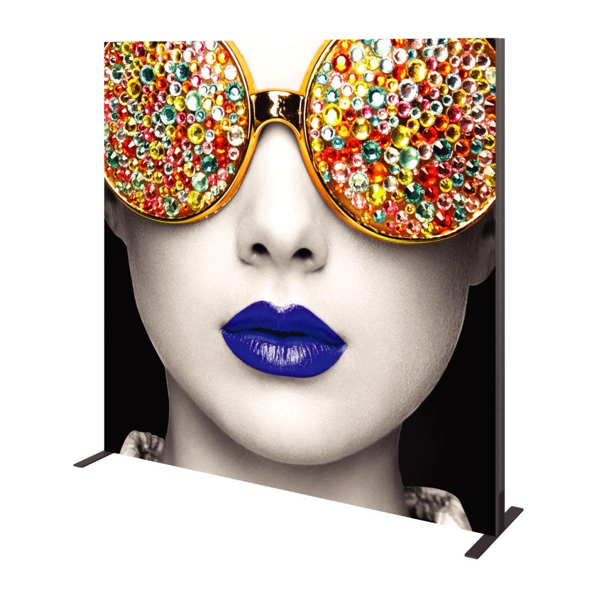 Large promotional trade show backdrop featuring close-up of a woman's face with embellished sunglasses and vibrant lips