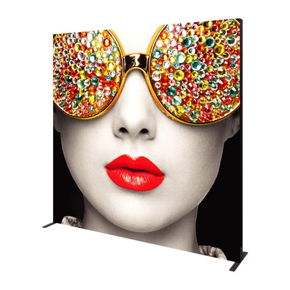 Large trade show display featuring close-up image of woman wearing sunglasses with decorative gemstones