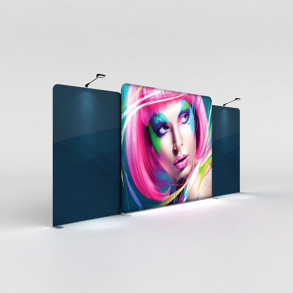 LED backlit display showcasing vibrant artwork in a trade show exhibit with focused overhead lighting